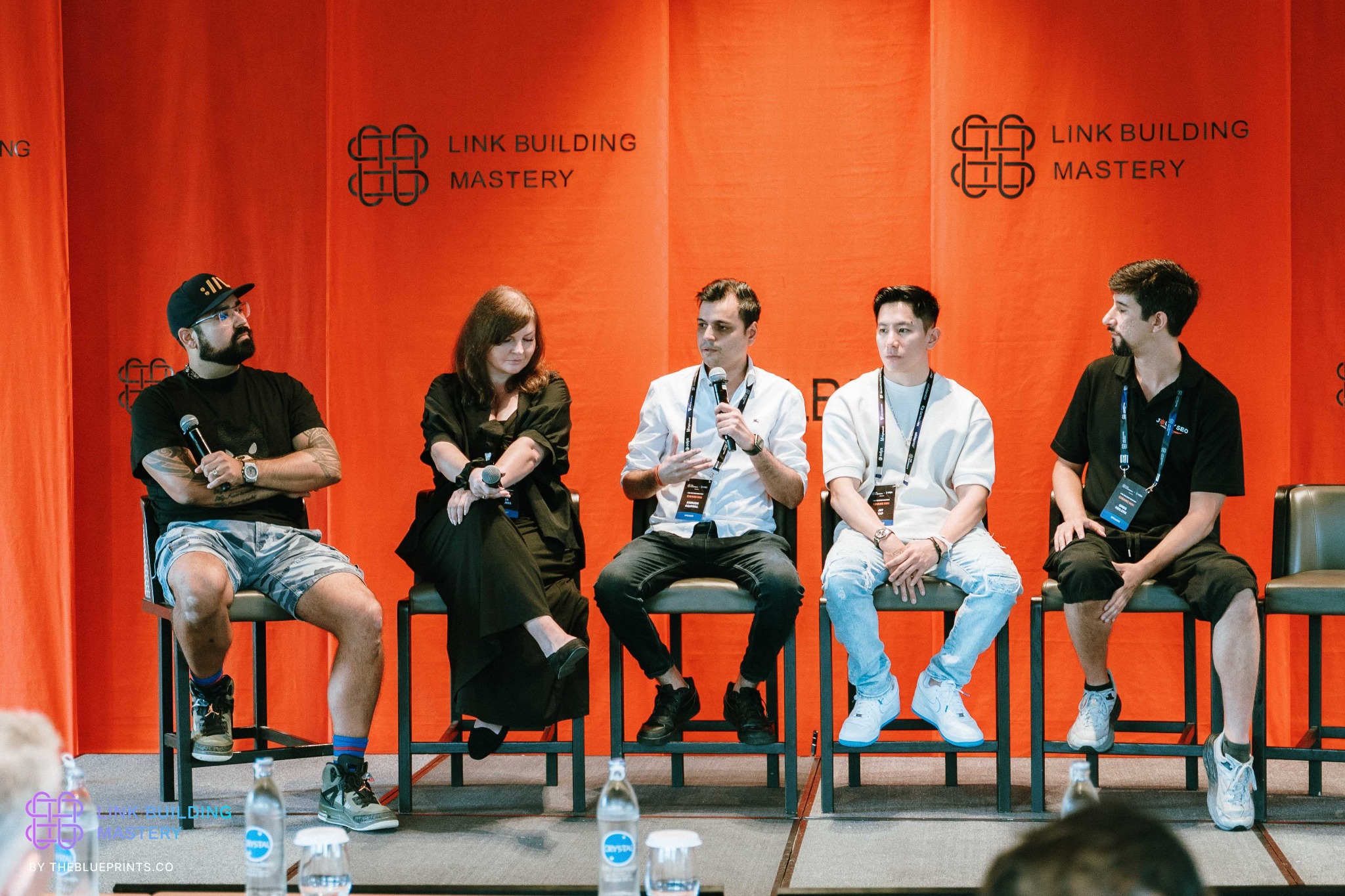 George Blandford seated with fellow speakers at Link Building Mastery